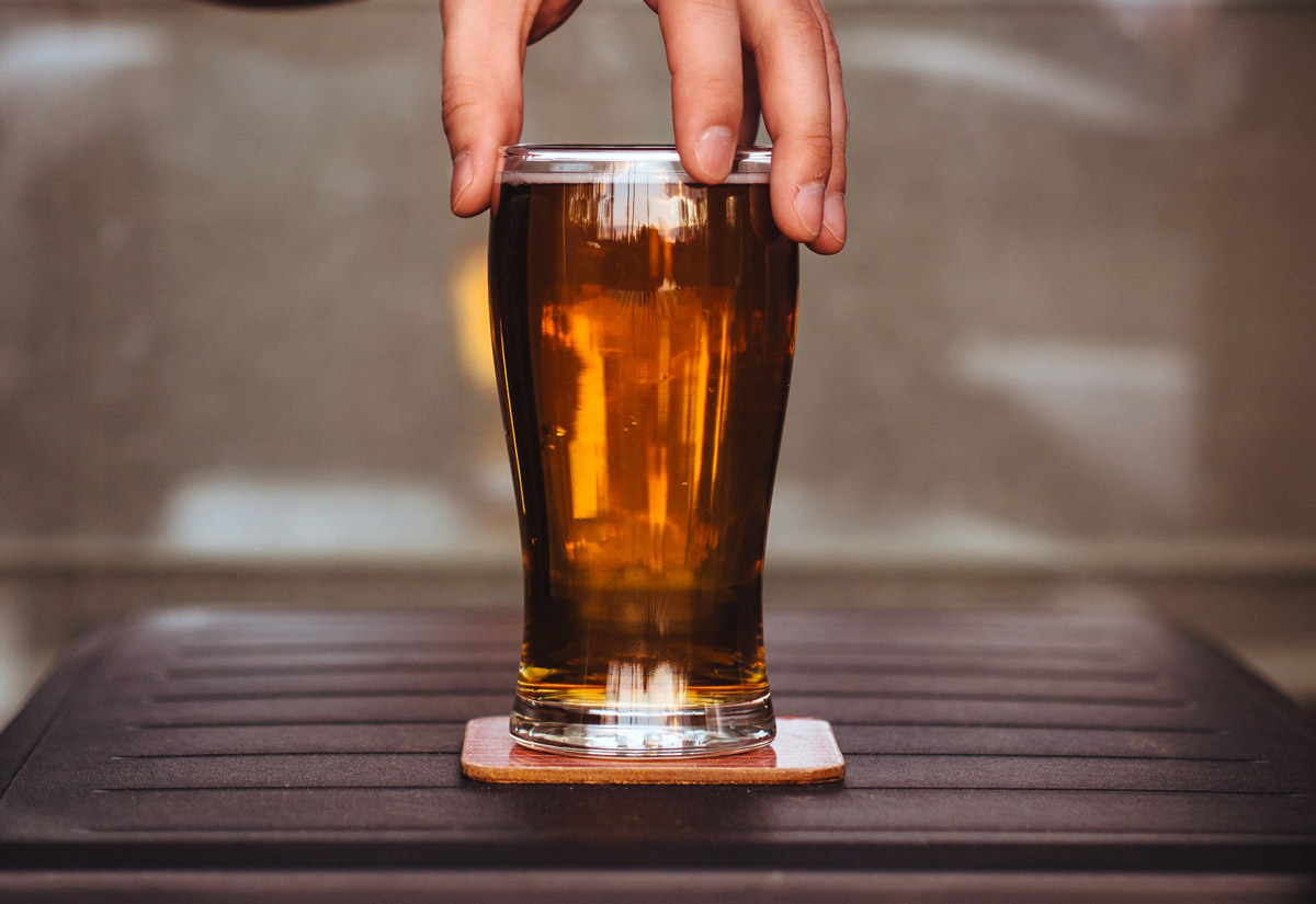 Original man holding beer